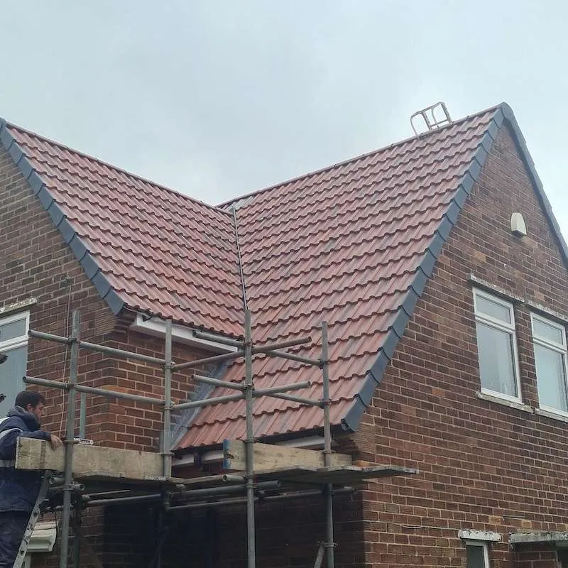 AL Roofing & Sons Ltd working on a residential roof